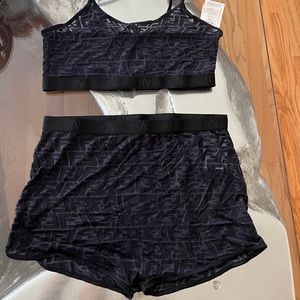 2 piece swim shorts and top . Worn once